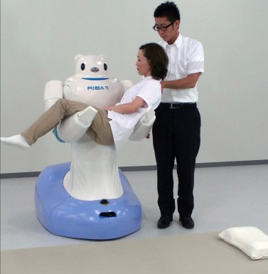 Japanese robots transfer patient from bed to wheelchair